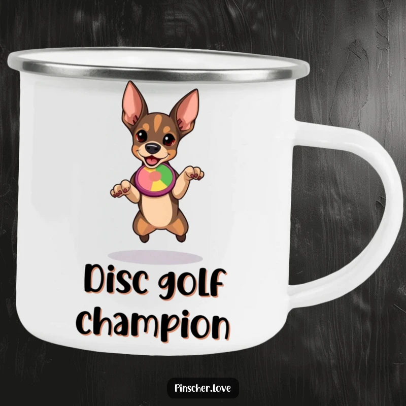 Funny Pinscher camping mug showcasing a determined dog ready to leap for a colorful flying disc, embodying outdoor action.