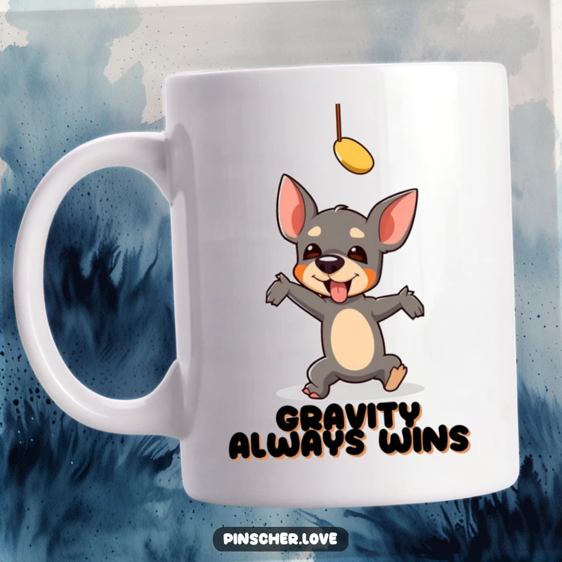 Funny Pinscher Mug: A pinscher comically falls while reaching for a dangling toy, capturing a hilarious moment of playful struggle.