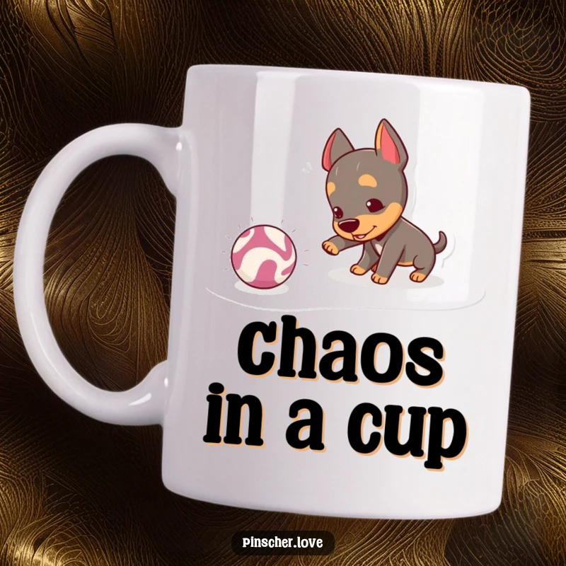 Funny Pinscher Mug: A mischievous pinscher playfully nudges a bouncing, crinkly ball, radiating pure, unadulterated playtime joy.