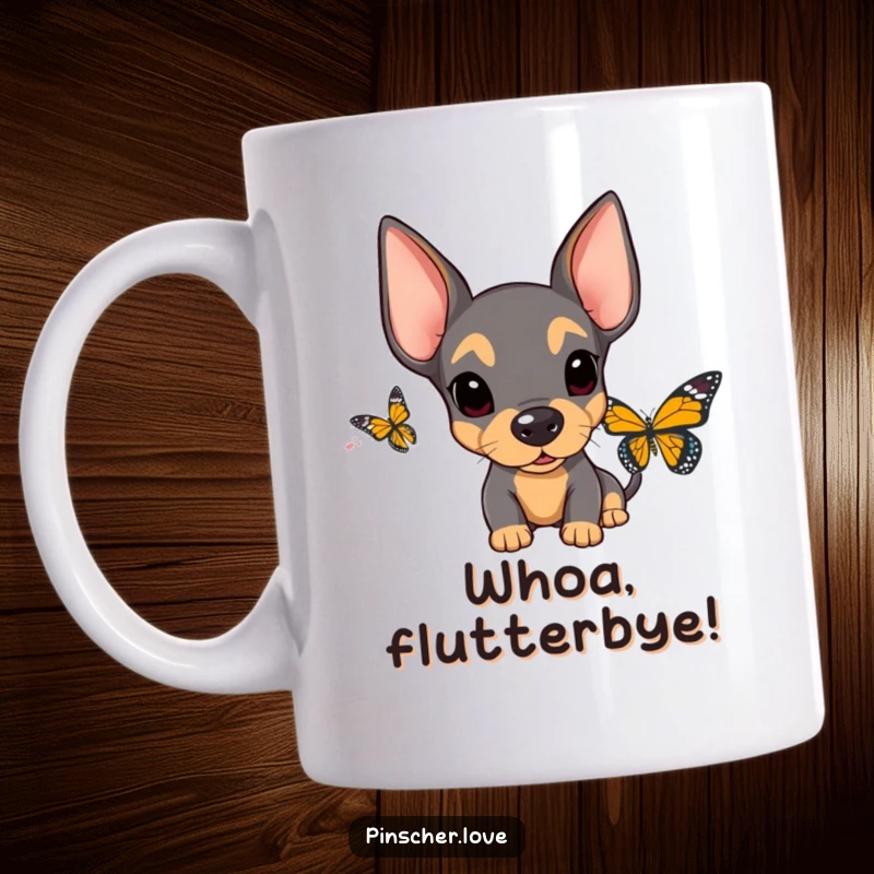 Funny Surprised Pinscher Mug: A pinscher with wide eyes and floppy ears looks utterly shocked by a hovering butterfly, a humorous moment.
