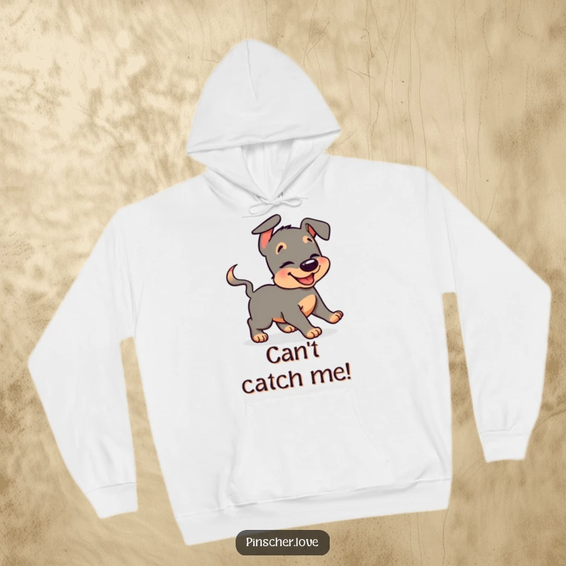 Funny pinscher hoodie with a giggling dog in a humorous, circular chase after its own wagging tail, perfect for cozy laughs.