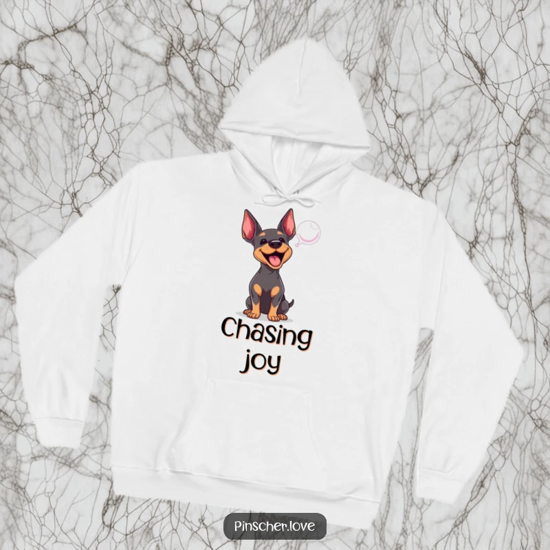 Funny Pinscher hoodie featuring an energetic dog barking at a floating bubble, perfect for cozying up with playful vibes.