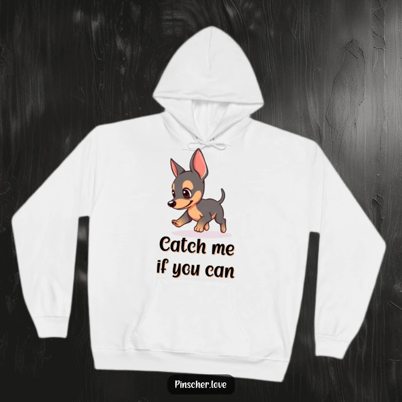 Funny hoodie featuring a Pinscher dog with perked ears, playfully chasing its tail, soft and warm, ideal funny gift for dog lovers.