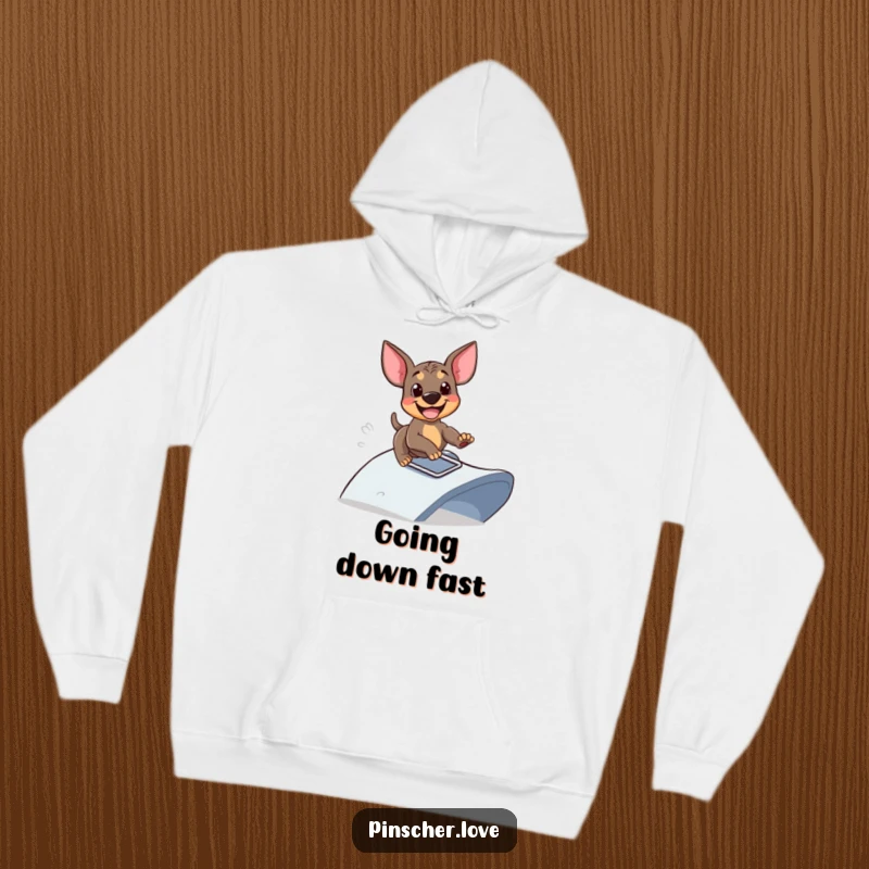 Funny hoodie featuring a happy Pinscher dog gleefully sliding down a playful ramp, soft and warm, ideal funny gift for fun lovers.