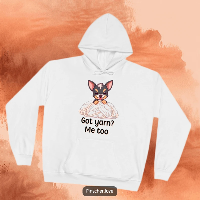 Funny Pinscher hoodie showing a Pinscher dog blissfully burying itself in a giant pile of fluffy, colorful yarn.