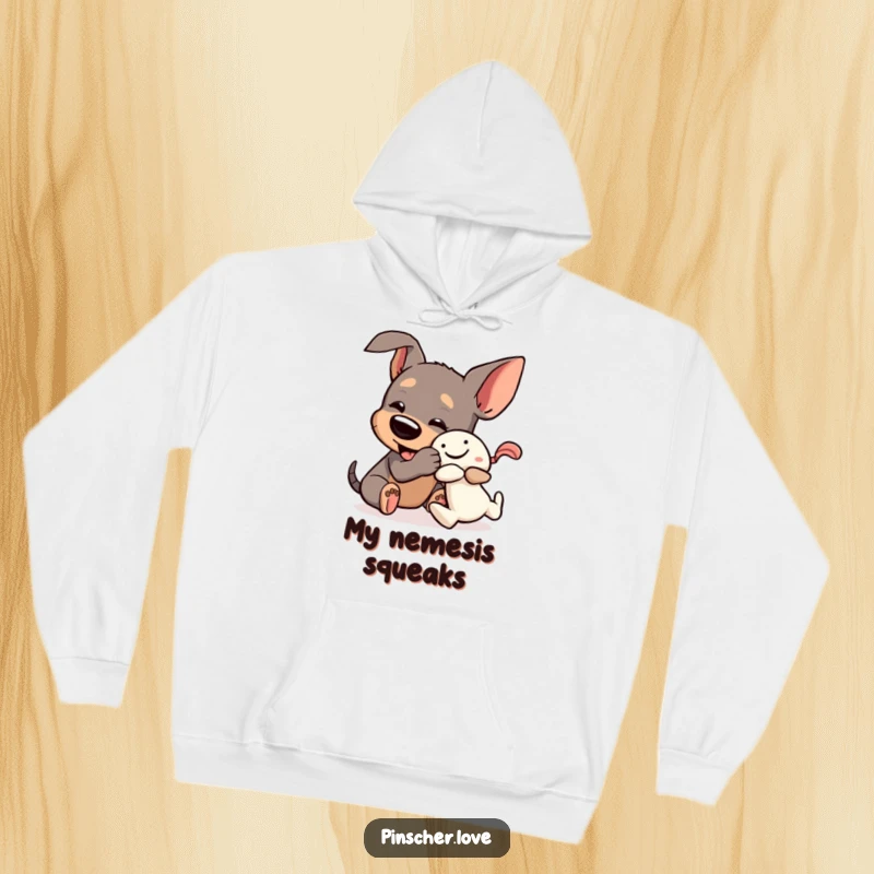 Funny Pinscher Hoodie: A dog joyfully wrestles a squeaky toy, showcasing its playful and humorous nature in a cozy design.