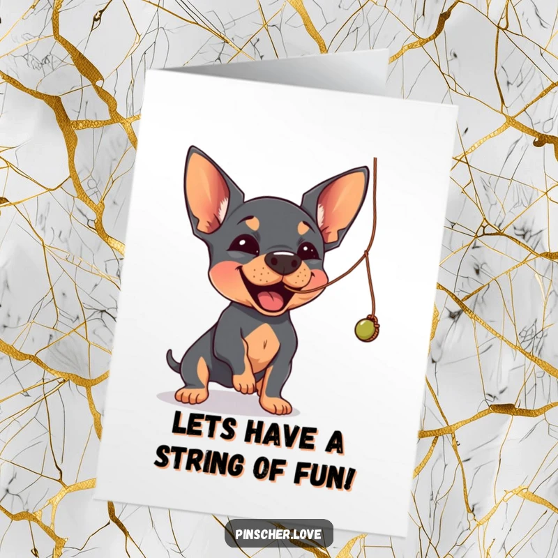 Funny Free Printable Birthday Card: A Pinscher joyfully swatting at a dangling, wobbly string with playful energy.