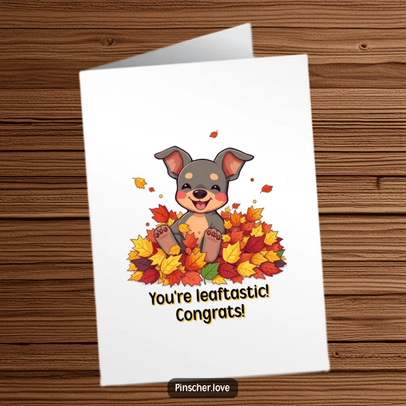 Funny Free Printable Congratulations Card of a pinscher rolling in autumn leaves, celebrating success with seasonal abandon.