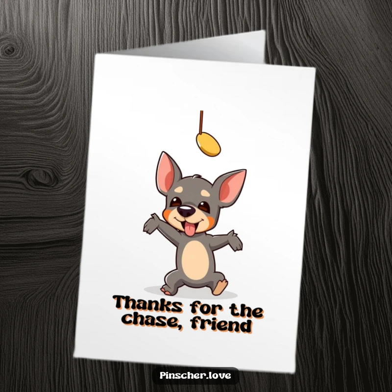 Funny Free Printable Thank You Card: A pinscher hilariously tumbles in pursuit of a dangling toy. A comical thank you note.