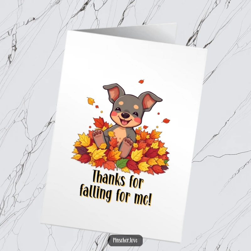 Funny Free Printable Thank You Card of a pinscher joyfully rolling in colorful autumn leaves, conveying thanks with seasonal cheer.