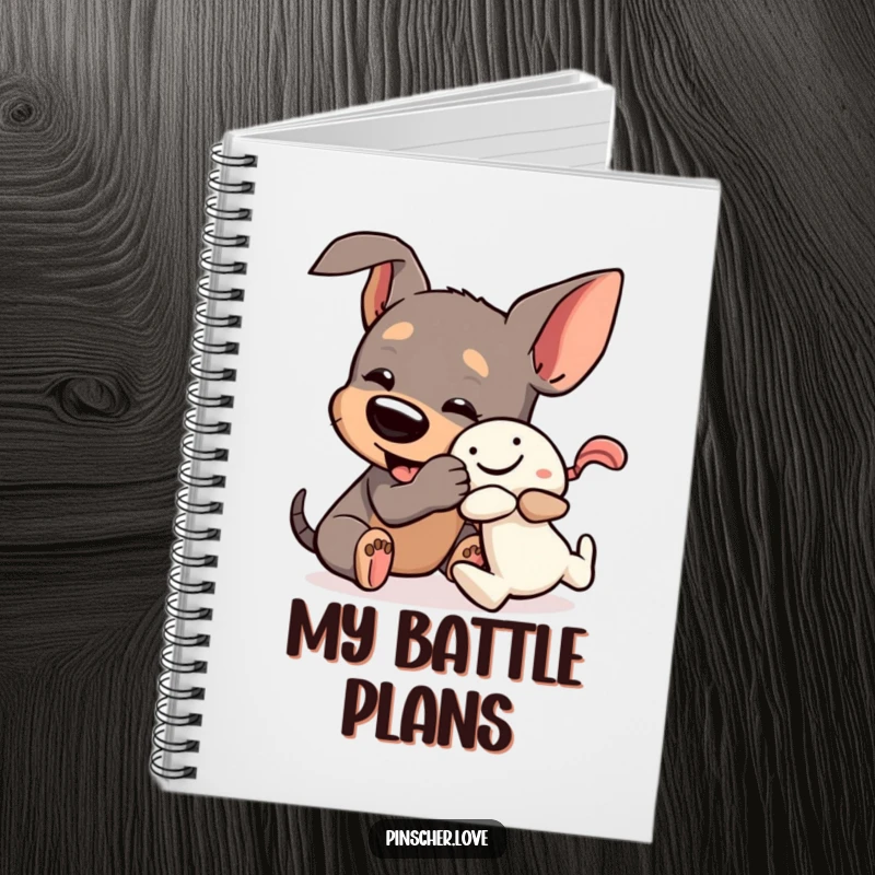 Funny Pinscher Notebook: A dog playfully wrestles a squeaky toy, great for capturing notes with a hint of humor.