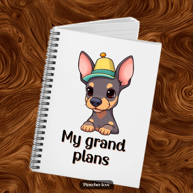 Funny Pinscher notebook featuring a proud dog balancing a colorful hat on its nose, perfect for notes and creative ideas.
