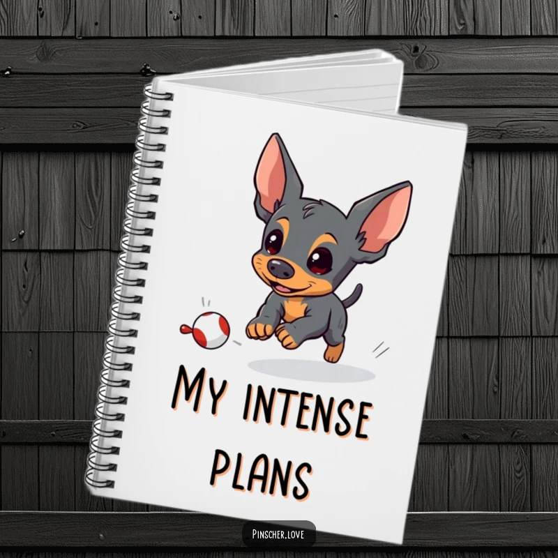 Funny pinscher notebook featuring an energetic pinscher dog focused on chasing a small, fleeing toy, ideal for notes.