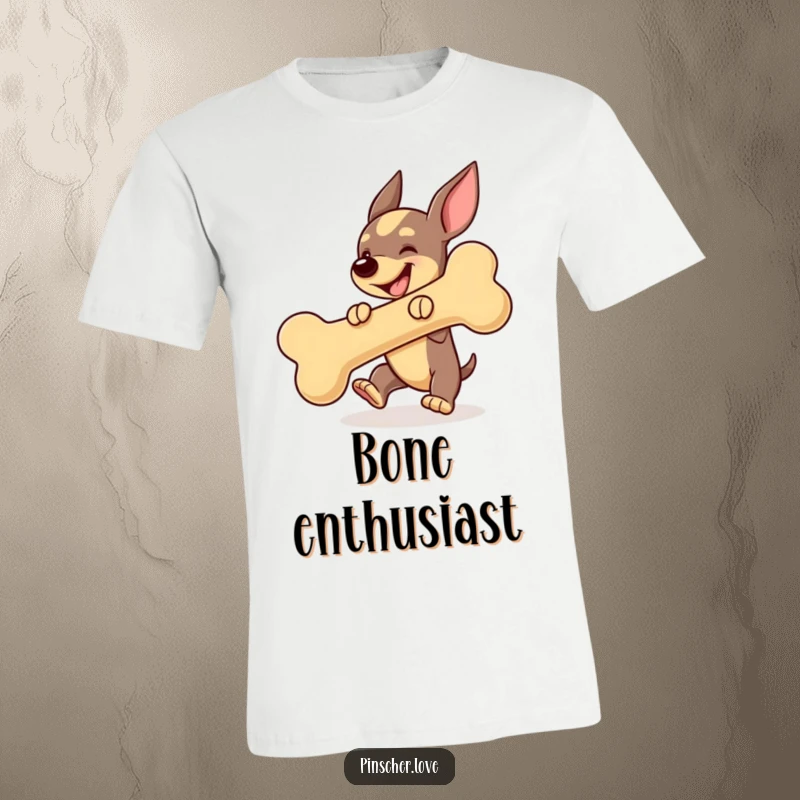 Funny Pinscher dog t-shirt, gleefully bouncing a giant squeaky bone, embodying pure canine joy and excitement.
