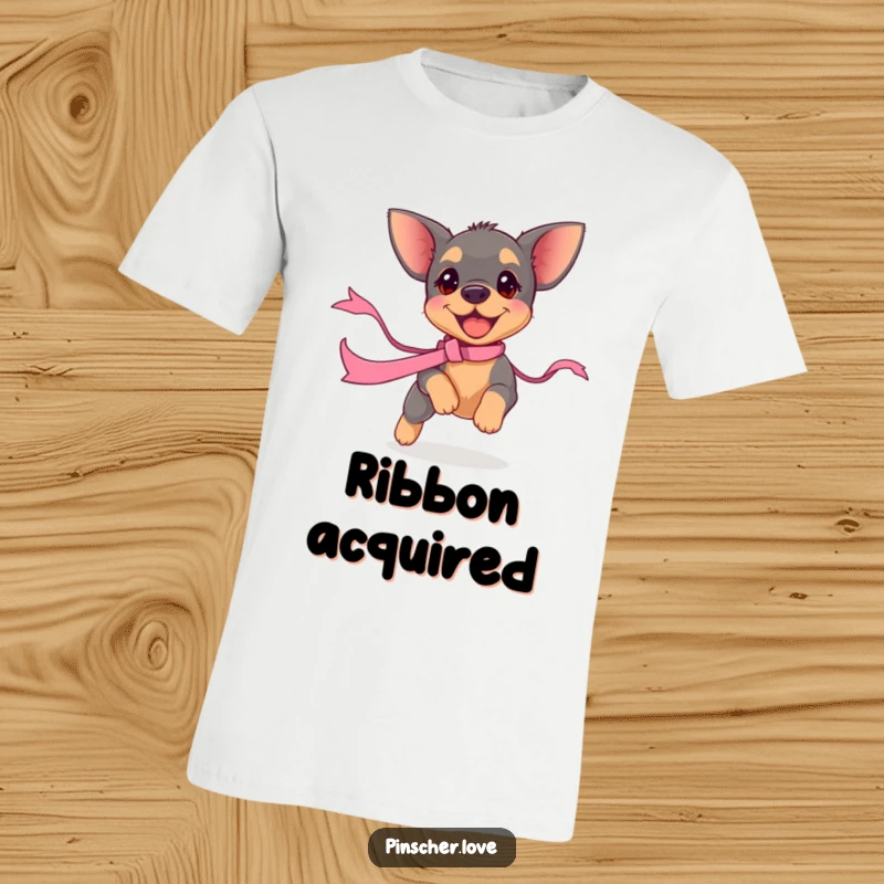 Funny pinscher puppy t-shirt featuring a small dog in hot pursuit of a dancing ribbon. Captures playful chaos and canine delight.
