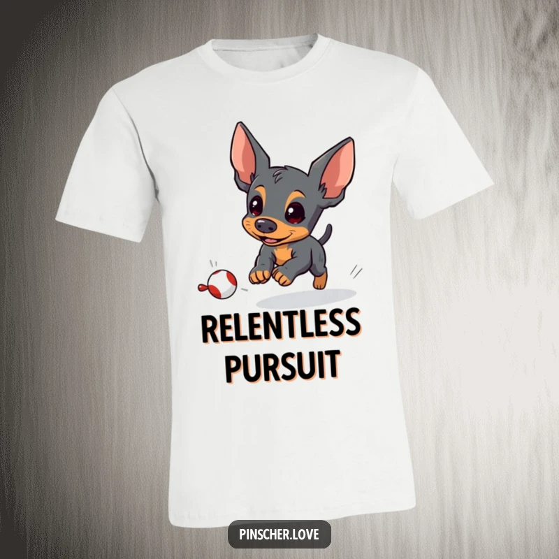 Funny pinscher t-shirt featuring an energetic pinscher dog focused on playfully chasing a small, fleeing toy with determination.