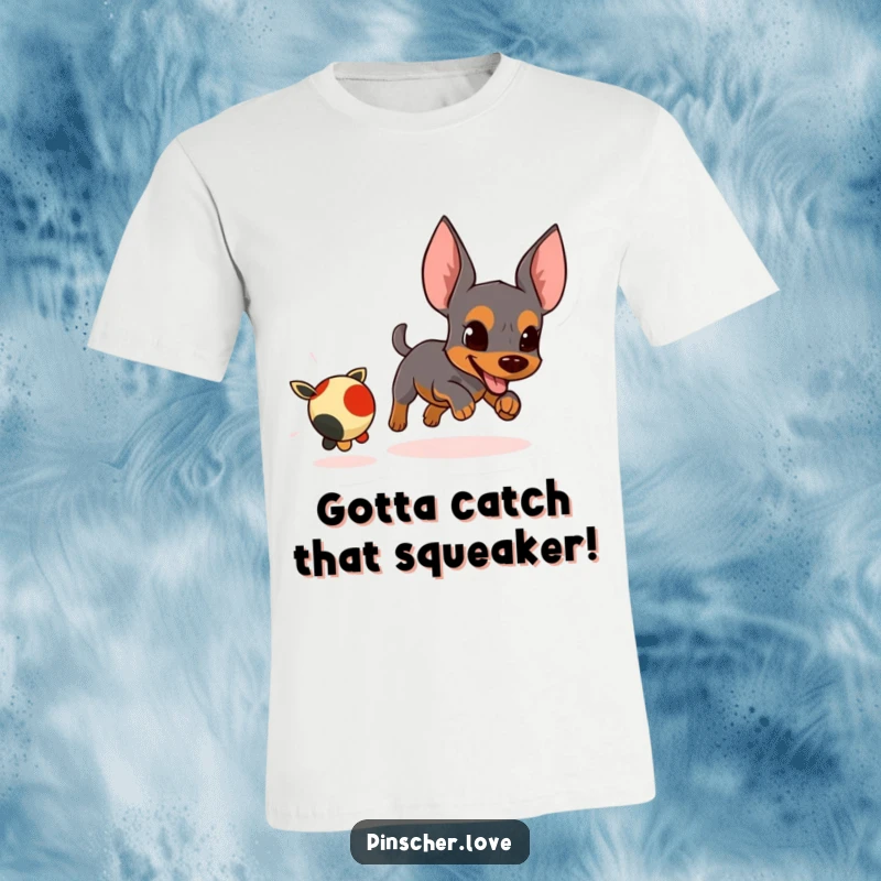 Funny t-shirt featuring an energetic pinscher character in hot pursuit of a small, fleeing toy.
