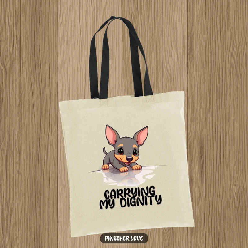 Funny Pinscher Tote Bag depicting a dog comically slipping on a polished floor, ideal for carrying items with humor.