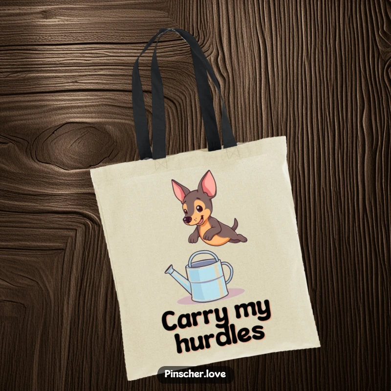 Funny pinscher dog captured mid-leap over a small watering can, making this tote bag a humorous and eye-catching accessory
