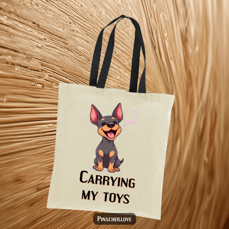 Funny Pinscher tote bag with an excited dog enthusiastically barking at a bubble, perfect for carrying essentials with flair.