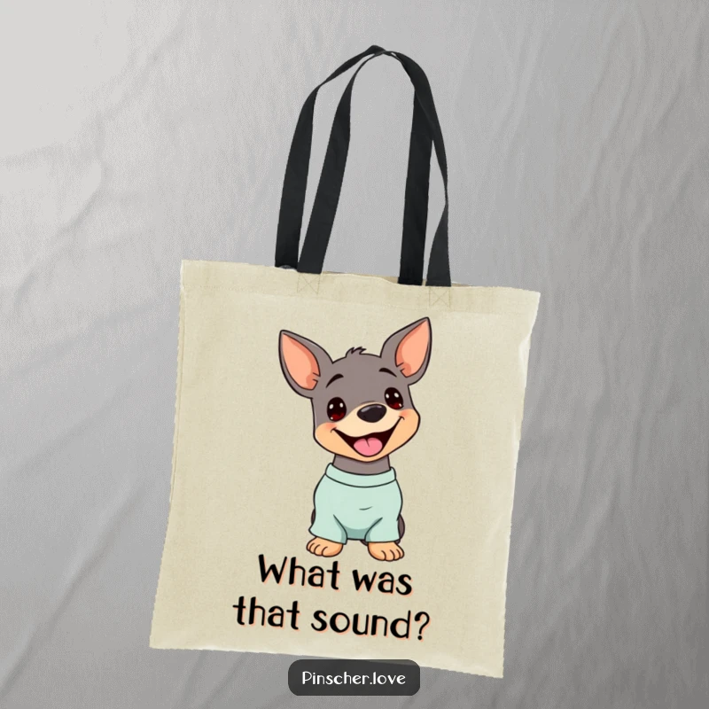 Funny Pinscher Tote Bag: A dog tilts its head with a happy pant, showcasing a playful and humorous canine attitude.